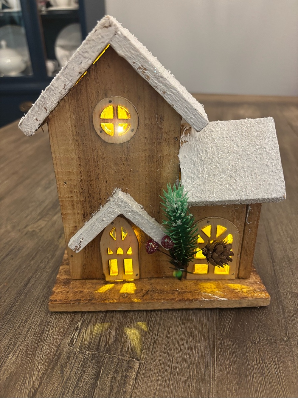 Rustic Wooden Snow-Capped Holiday House with Warm LED Light